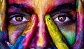 a face covered with various bright and vibrant colors